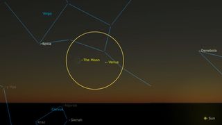a view of the night sky showing a bright yellow orb next to a tiny sliver of a crescent moon